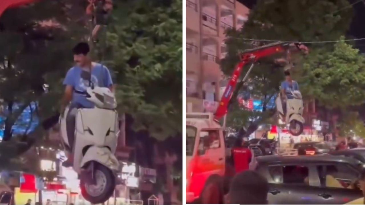 नो पार्किंग से स्कूटी उठाने पर हंगामा, युवक को स्कूटी समेत क्रेन से हवा में लटकाया; वीडियो वायरल
